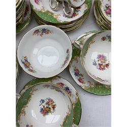 1950s Paragon Rockingham dinner and tea service comprising eight dinner plates, twelve side plates, seventeen teacups & eighteen saucers in varying sizes, sandwich plate, teapot, two sugar bowls, two milk jugs, nine soup bowls, ten saucers and thirty-five tea plates, of varying size