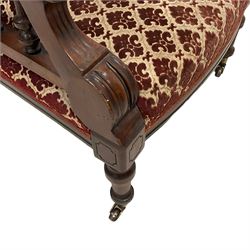 Late Victorian Aesthetic Movement mahogany open armchair, turned spindle arm supports, upholstered in buttoned foliate patterned fabric with sprung seat