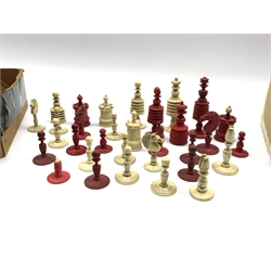 Collection of 19th century turned ivory and bone chess pieces in plain and red stained, incomplete sets