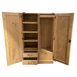 Victorian stripped pine press wardrobe, fitted with two panelled doors enclosing three sliding trays over two drawers, and sliding hanging rail with coat hooks over a fall-front cupboard, skirted base