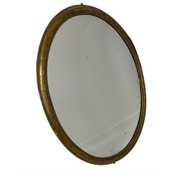 19th century gilt framed oval wall mirror, the stepped frame with moulded acanthus leaves, and crescent moon carvings 