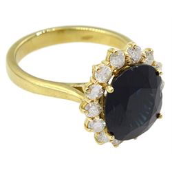 18ct gold oval sapphire and round brilliant cut diamond cluster ring, hallmarked, sapphire approx 4.85 carat, total diamond weight approx 0.30 carat