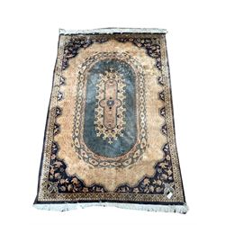 Persian design beige ground rug, with stylised floral design and bordered 289cm x 183cm