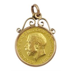 King George V 1911 gold half sovereign coin, loose mounted in gold pendant, stamped 9ct