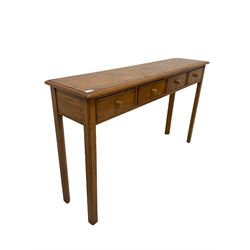 Figured oak hall table, the cross banded top with satinwood inlay over four frieze drawers, raised on square supports with pencil moulding and chamfered inner edge W 131cm, H77cm, D30cm