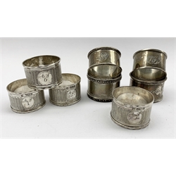 Three engraved and numbered late Victorian silver serviette rings Sheffield 1892, another very similar Birmingham assay mark and four other serviette rings 5oz 