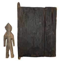 African Dogon  granary door heavily carved with stylised flowers etc 28cm x 22cm and a small carved wood African figure 19cm (2)