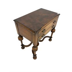 Queen Anne style walnut low boy, the rectangular top and moulded edge over two drawers, raised on turned supports, united by an X stretcher 