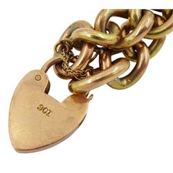 Early 20th century 9ct gold curb link bracelet, with heart locket clasp, each link stamped