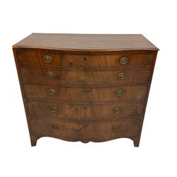 George III mahogany serpentine secretaire chest, the fall-front with inset writing surface enclosing twelve small drawers and pigeon-holes, over three graduating drawers with cockbeaded fronts, with shaped apron