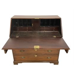 George III mahogany bureau, fall-front enclosing fitted interior,  above four graduating cockbeaded drawers, each with brass handles, raised on bracket feet