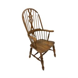 Beech Windsor armchair, stick and hoop back with shaped and pierced splat, dished seat on turned supports joined by double H stretcher