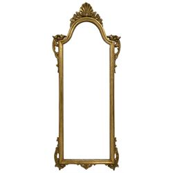 Regency design gilt framed wall mirror, the central shell pediment with extending foliate decoration and C-scrolls