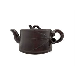 Chinese Yixing stoneware teapot and cover, of circular form with bamboo moulded spout and handles, impressed seal beneath L19.5cm 