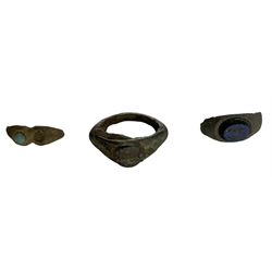 Roman British - three copper alloy finger rings, two with blue central stones, Roman mount in rhw form of a bust (possibly Harpocrates), small spoon, figurine of human form, two weights (one lead) and a mount with lion mask decoration, all circa 1-300 AD