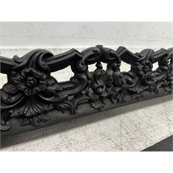 Three Victorian design graduated cast iron fire fenders, each of rounded rectangular form, cast with acanthus scrolls and flowering festoons, together with a similar design fender, L127cm x D25cm