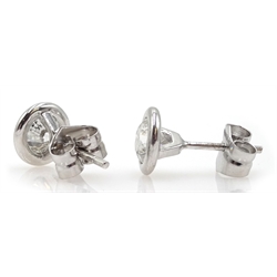 Pair of 18ct white gold bezel set diamond stud earrings, stamped 750, diamond total weight approx 1.60 carat