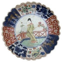 Chinese Kangxi imari verte plate, centrally painted with a lady in a garden, within a scalloped border, D18cm together with two Japanese blue and white vases (3)
