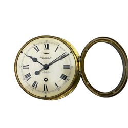 A 20th century English ships bulkhead clock having a 6” dial with roman numerals, five-minute Arabic’s and minute track, with a centre sweep seconds hand and time regulation lever, dial bearing the retailers name ”James Morton, Sunderland” along with the “Sestrel” trademark, heavy bevelled glass within a hinged brass bezel, going barrel eight-day movement with a lever platform escapement manufactured by Elliot of London, 8” brass drum case with fixing flange. With key. 
