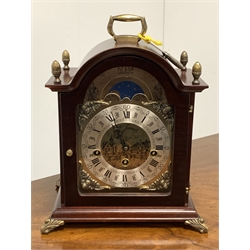20th century Westminster chiming bracket clock, the stained hardwood case with brass finials and supports, brass dial with moon phase over silvered Roman numeral chapter ring, Hermle movement  with floating balance West German movement, together with an Estyma mantle clock with mechanical movement and photograph frame 