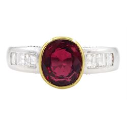 18ct white and yellow gold oval cut ruby ring, with channel set princess cut diamond shoulders and round brilliant cut diamond gallery, hallmarked, ruby approx 2.20 carat