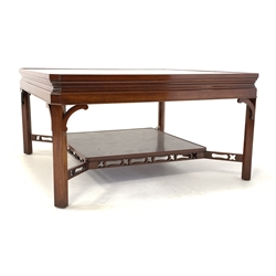 20th century mahogany coffee table, square top with canted corners raised on chamfered supports united by under tier 
