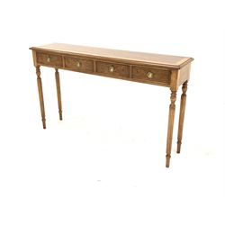 Figured walnut hall table, burr top with cross band over four frieze drawers, raised on turned reeded supports 131cm x 30cm, H77cm