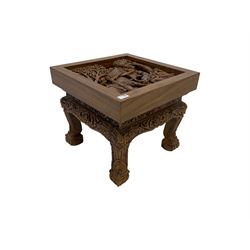 Hardwood occasional table, the square top carved with scene of figures on elephants, the frieze and cabriole supports carved with flower heads and scroll designs