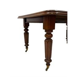 Early Victorian mahogany dining table, moulded rectangular telescopic extending top with rounded corners, with single additional leaf, on turned and reed carved supports, brass cups and castors, with winder 