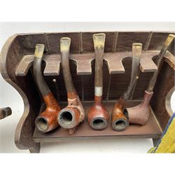 Collection of pipes including a Orlik Hurricane, two carved meerschaum pipes, Parker pipe,  and others including ceramic and carved examples, together with four pipe racks