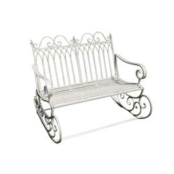 Regency design wrought metal garden rocking bench, scrolled cresting rail flanked by finials, arched design back over strap seat, scroll decorated end supports, in cream finish
