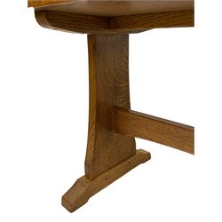 Possibly Beaverman - oak side table, rectangular top on shaped end supports with sledge feet joined by a pegged stretcher, unsigned 