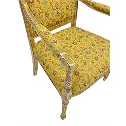 Pair French style cream and parcel gilt finish open armchairs, scrolled uprights, upholstered in deep yellow fabric decorated floral motifs, turned and fluted supports