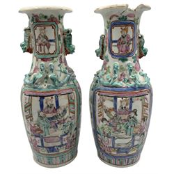 Pair Chinese Canton Famille Verte vases, each painted with reserves of officials and warriors on horseback, each with Dog of Fo handles and applied dragons to the shoulders, H25.5cm