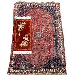 Hamadan rug of stylised floral design on a red field and bordered, (315cm x 204cm) and a washed Chinese hearth rug