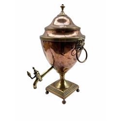 Early 19th century copper tea urn with lion mask ring handles, brass tap and square base H45cm