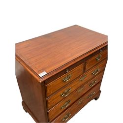 George III walnut bachelors chest, the rectangular top with chequered inlay, over dressing slide and two short and three long inlayed graduated drawers raised on bracket supports  