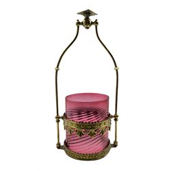 19th/ early 20th century hall lantern with brass tubular support, embossed and pierced brass frame with scalloped border and a cylindrical cranberry glass wrythen shade, H60cm