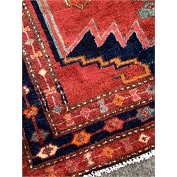 Persian Hamadan ground rug, pole medallion on red field with geometric decoration, enclosed by multi line border, 196cm x 115cm