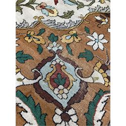 Persian design hand knotted ground rug, the brown and blue floral medallion on ivory field with brown spandrels, enclosed by double guarded border 280cm x 376cm