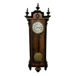 German - 8-day weight-driven 19th century Vienna regulator, in a walnut and ebony case with finials, fully glazed door and side panels, enamel dial with Roman numerals and fretted steel hands, striking the hours and half hours on a coiled gong. With pendulum and weights.