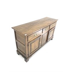 George III oak dresser base, three drawers over three panelled cupboards, raised on bracket supports W150cm, H86cm, D49cm