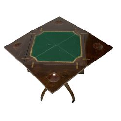 Late Victorian inlaid rosewood envelope card table, square top with swivel and folding action revealing baize lined interior with sunken counter wells, inlaid with urns and trailing leafy branches, on central reeded column surrounded by four small pillars, quadruple splayed supports inlaid with trailing bell flowers, brass and ceramic castors