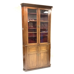  19th century mahogany floor standing corner cupboard, dentil cornice over two glazed doors enclosing four shaped shelves, panelled cupboard doors under, W105cm, H216cm, D65cm  