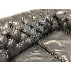 Tetrad Chesterfield two seat sofa, upholstered in deep buttoned black leather with squab cushions W165cm, H70cm, D100cm