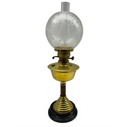 An Eltex brass column table oil lamp with etched glass shade