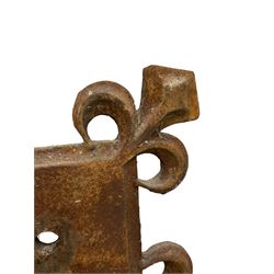 Two cast iron stands or base plaques, moulded square form with projecting fleur-de-lis corners 