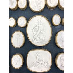 Group of twenty Grand Tour plaster intaglios, contained in a single tray, 26cm x 17cm 