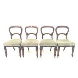 Set of four Victorian dining chairs with balloon backs and scroll leaf carved rails, upholstered seats, raised on turned and lobe carved front supports 