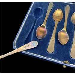 Set of four sterling silver bridge pencils, cased and a set of eight Art Deco design silver gilt coffee spoons Sheffield 1940 Maker Frank Cobb 